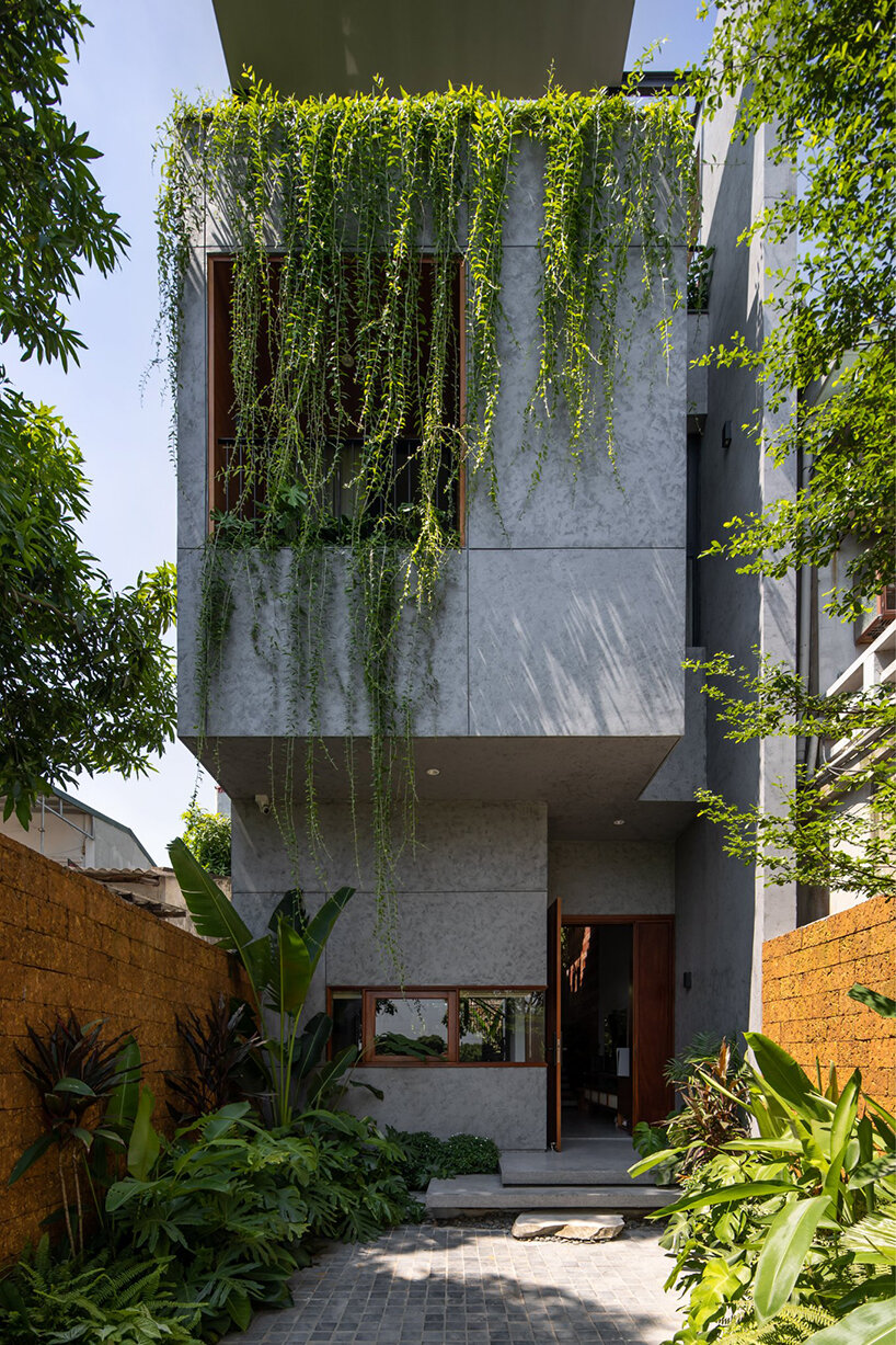 X11 design studio's plant-filled vietnamese house is inspired by paper folds