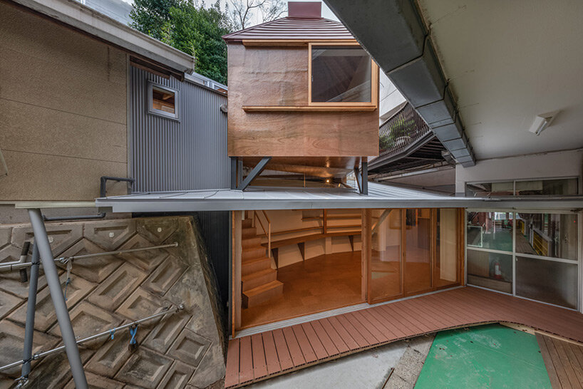 Maki Yoshimura builds nursery extension between two retaining walls in Japan