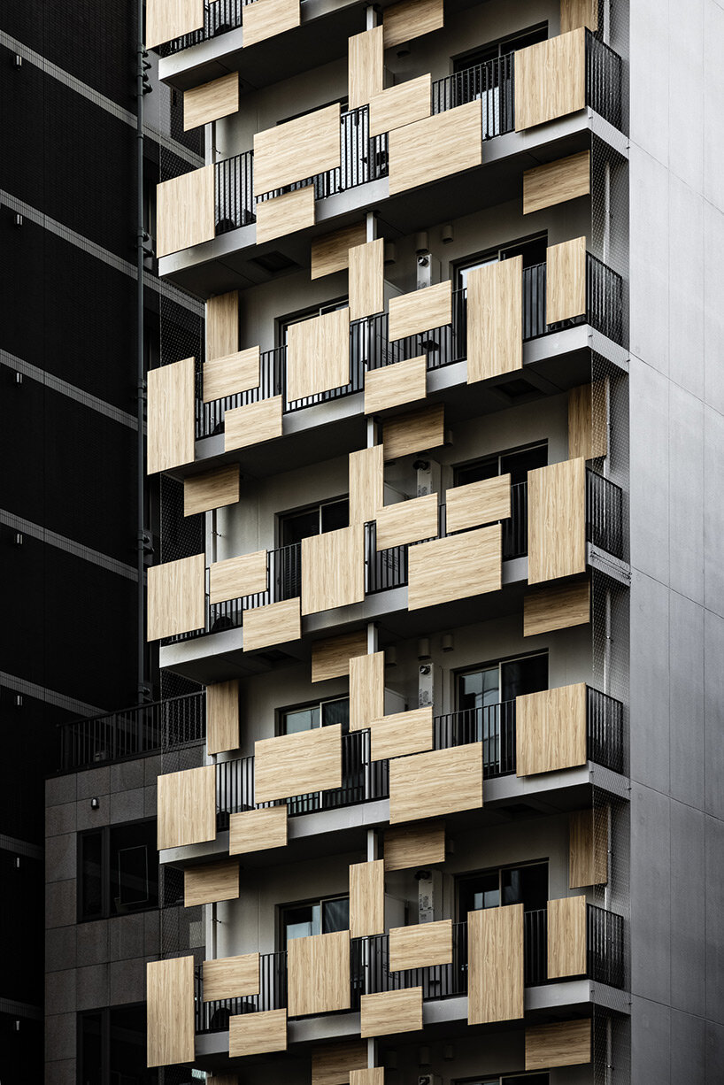 aluminum panels printed on wood pattern tetris-up the facade of kengo kuma's tokyo house