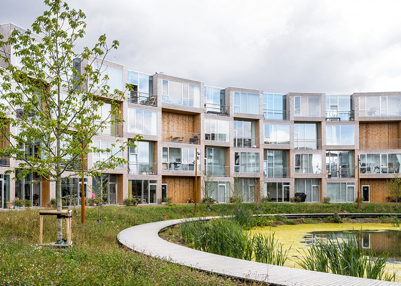 GRANDES' modular housing spirals around central pond in Danish sustainable suburb