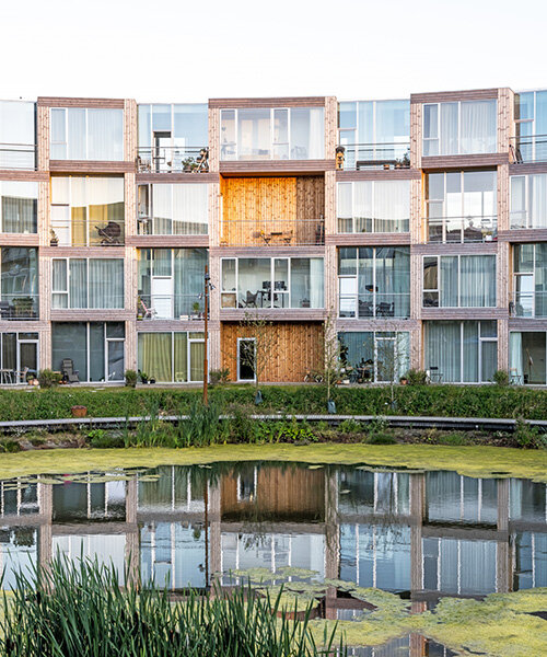 BIG's modular housing spirals around central pond in danish sustainable suburb