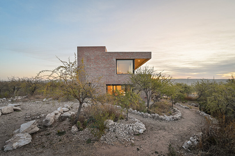 locally made bricks form energy efficient artist residence by loma arquitectos in argentina