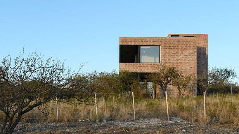 locally made bricks form energy efficient artist residence by loma arquitectos in argentina