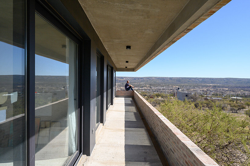 locally made bricks form energy efficient artist residence by loma arquitectos in argentina