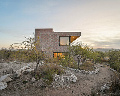 locally made bricks form energy efficient artist residence by loma arquitectos in argentina