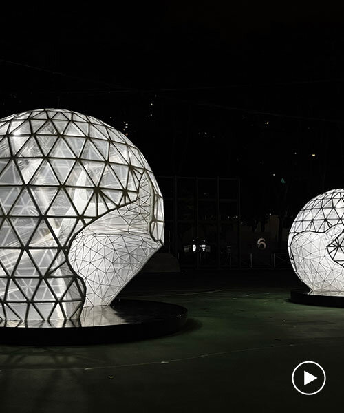 in celebration of the moon festival, spherical lanterns illuminate a soccer field in hong kong