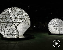 in celebration of the moon festival, spherical lanterns illuminate a soccer field in hong kong