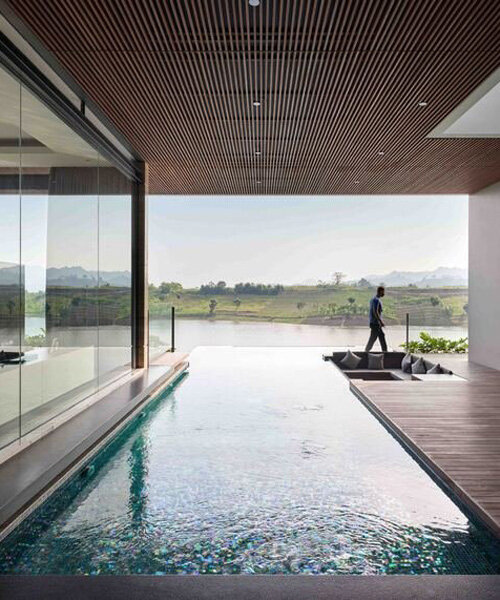 idyllic infinity pool protrudes from SM house to enjoy panoramic lakeside views in indonesia
