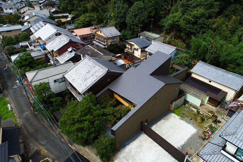 lush gardens and cave-like timber interiors characterize mega's weekend house in kyoto