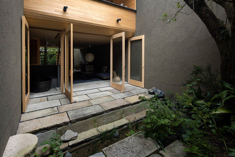 lush gardens and cave-like interiors characterize kyoto house by dai nagasaka/mega