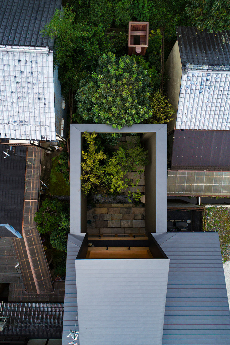 lush gardens and cave-like interiors characterize kyoto house by dai nagasaka/mega