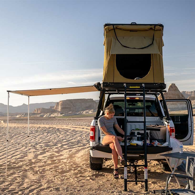 this lightweight pop-up tent creates a sleek tiny home on wheels