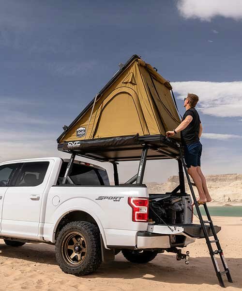 this lightweight pop-up tent creates a tiny sleek home on wheels