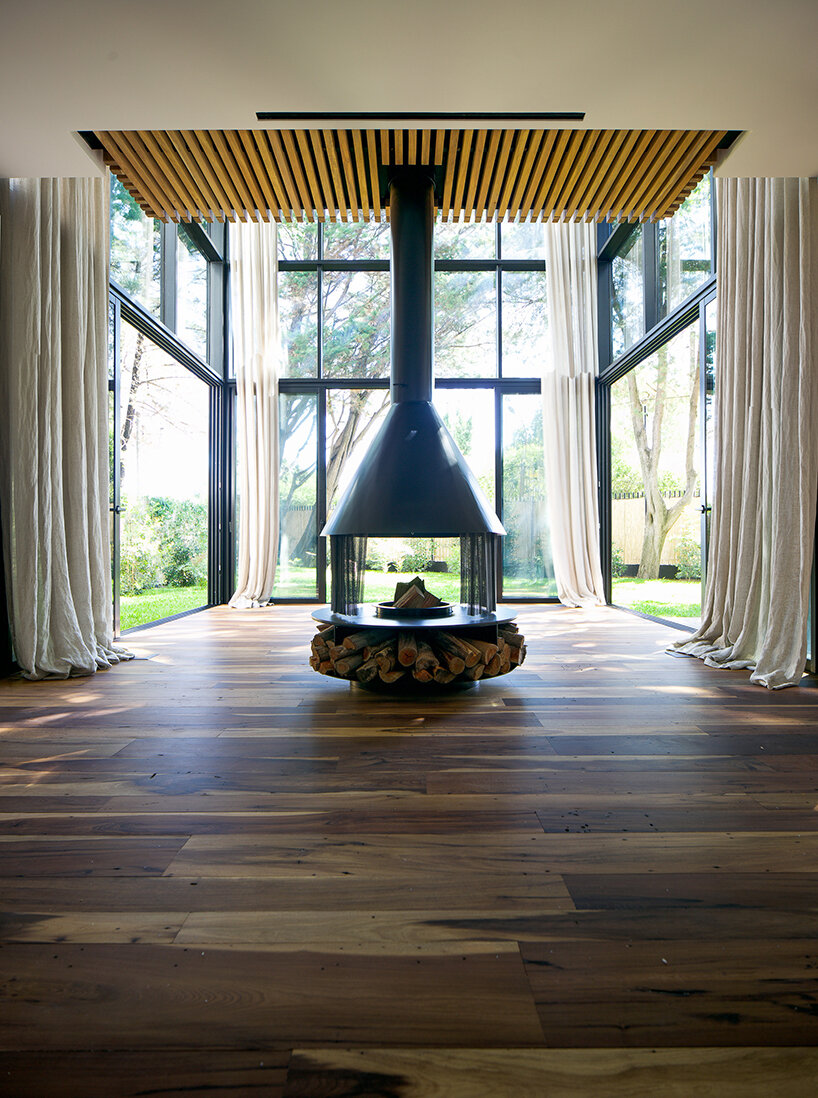 nestled in a cross-shaped plan, these duplex houses in uruguay boast striking visual rhythms