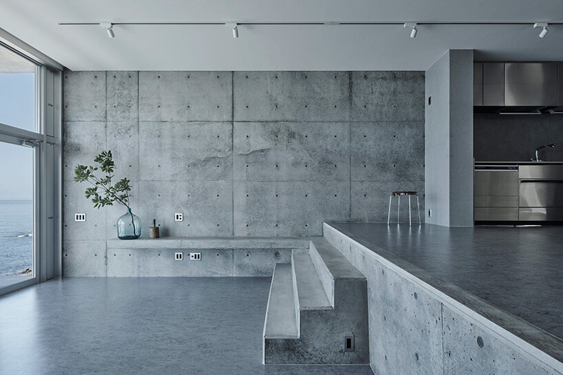 ninkipen! perches concrete seaside house on rugged national park landscape in japan