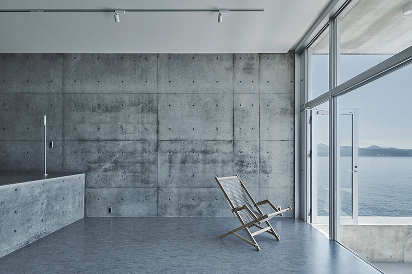 ninkipen! perches concrete seaside house on rugged national park landscape in japan