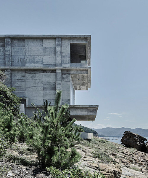 ninkipen! perches concrete seaside house on rugged national park landscape in japan