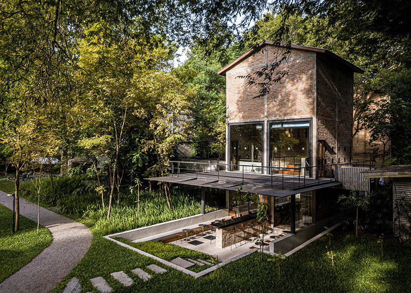 PAVA transforms old tobacco-drying barn into preserved brick teahouse in thailand