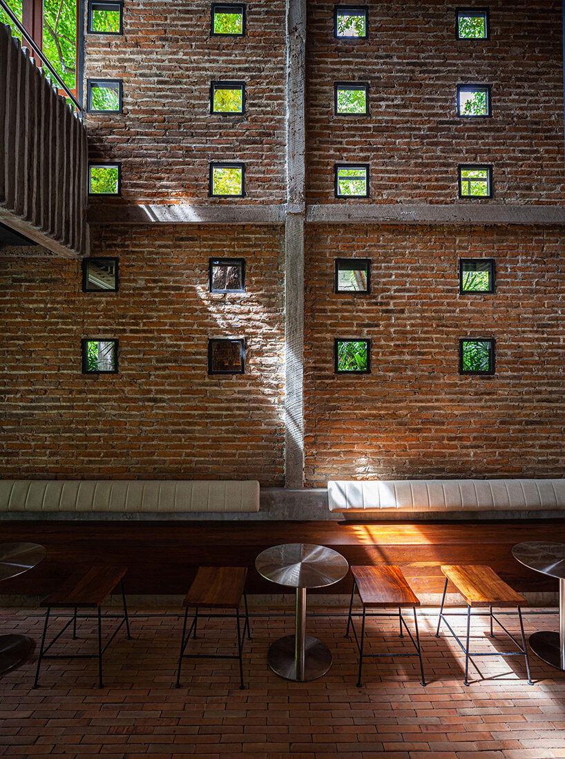 PAVA transforms old tobacco-drying barn into preserved brick teahouse in thailand