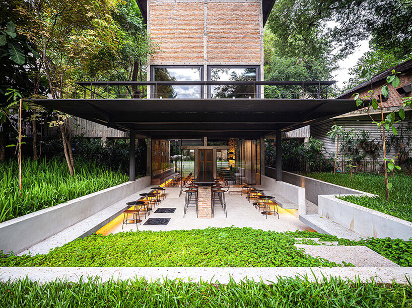 PAVA transforms old tobacco-drying barn into preserved brick teahouse in thailand