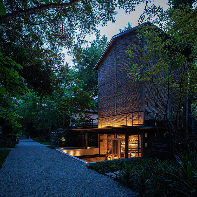 PAVA transforms old tobacco-drying barn into preserved brick teahouse in thailand
