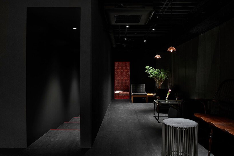 a movable, pleated artwork floods this japanese cafe with a homely ambiance
