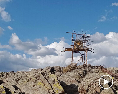 primitive wood and brass installation recalls nomadic huts and yurts of chinese village