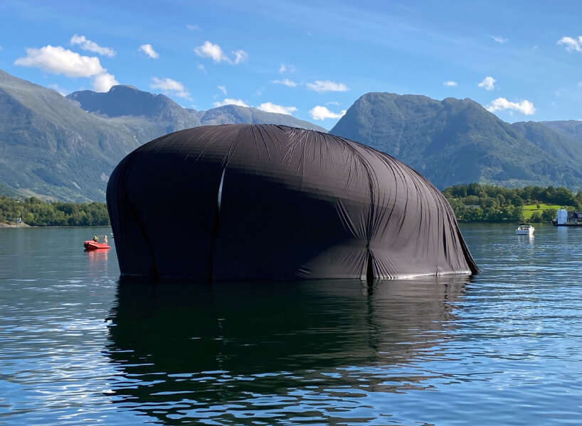 unveiled 'salmon eye' forum center floats in norway, accessible only by ferry