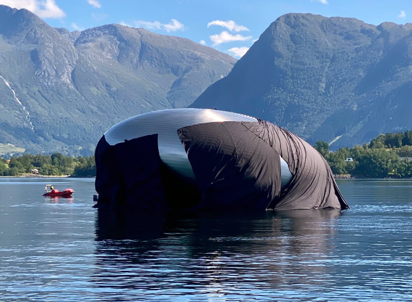 unveiled 'salmon eye' forum center floats in norway, accessible only by ferry