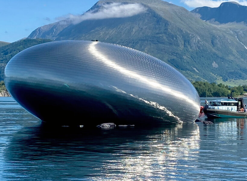 unveiled 'salmon eye' forum center floats in norway, accessible only by ferry