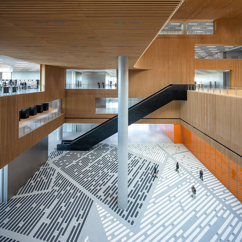 one of the world's largest libraries opens in shanghai, boasting sculptural forms