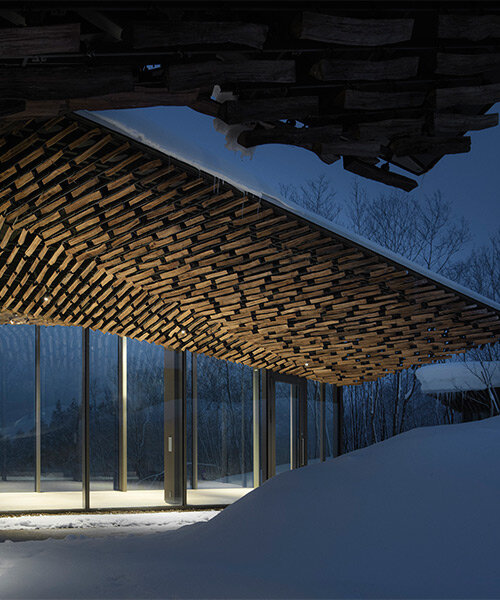 kengo kuma's firewood roof for 'snow peak' spa resort echoes mountain ridgeline in japan