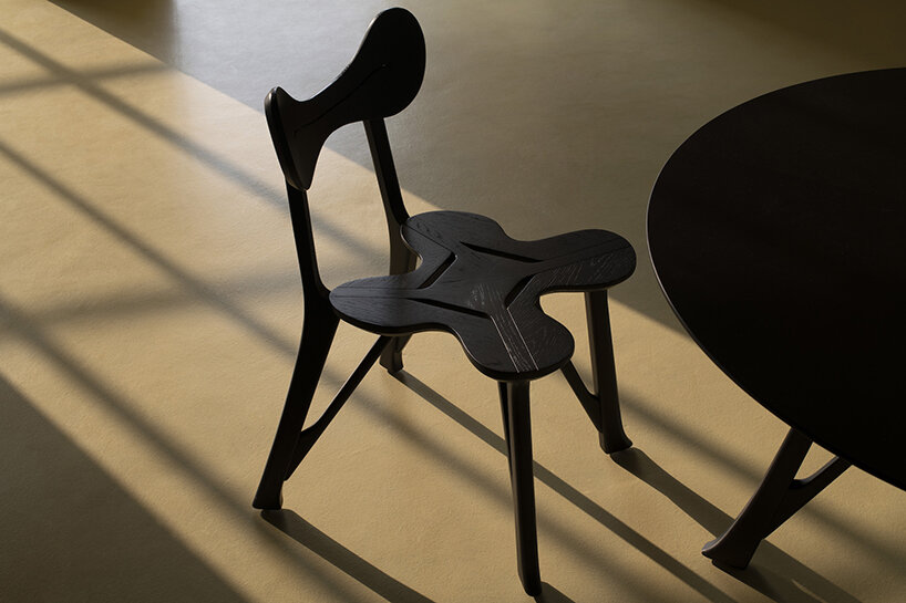 stellar works launches hand-carved chair & table set by michele de lucchi