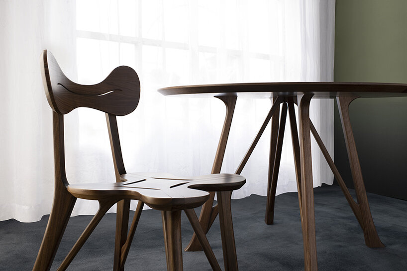 stellar works launches hand-carved chair & table set by michele de lucchi