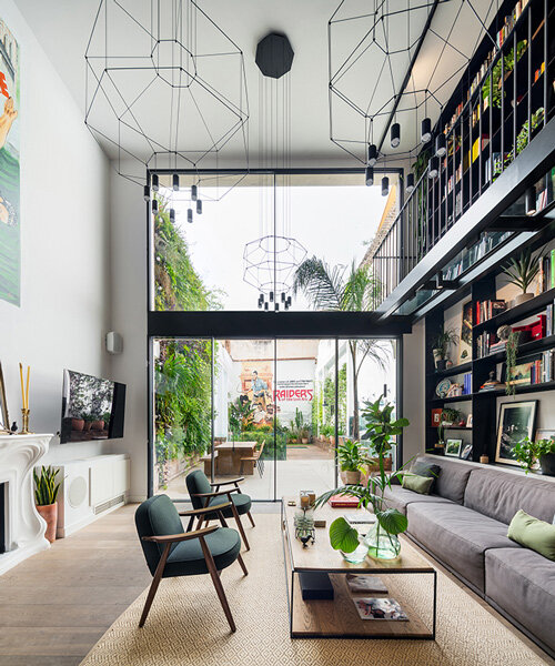 'the library' is a renovated triplex in barcelona with open, breathable spaces