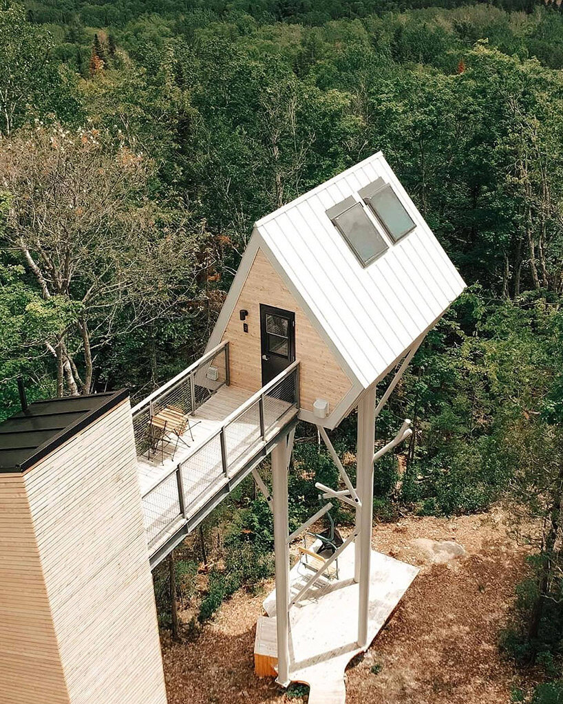 The UHU microcabin on stilts rises from the ground to offer sweeping views of the river in Canada