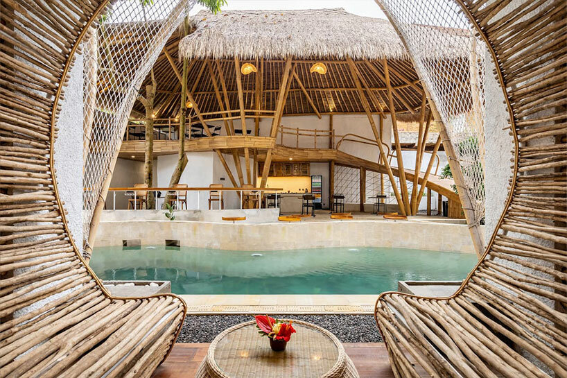 hotel renovation in bali celebrates bamboo with co-living space for digital nomads
