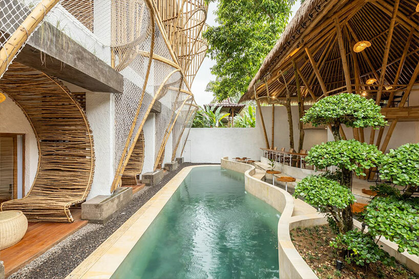 hotel renovation in bali celebrates bamboo with co-living space for digital nomads
