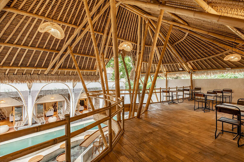 hotel renovation in bali celebrates bamboo with co-living space for digital nomads