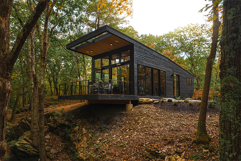 'Cabana' is a cantilevered, modernist retreat perched on a forested cliff in Rhinebeck, NY