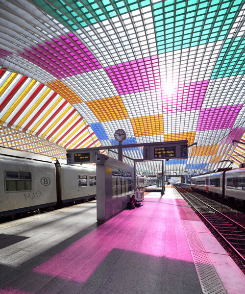 calatrava's belgium railway station is illuminated with artwork by daniel buren