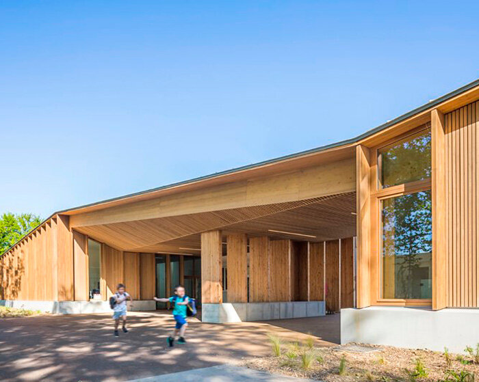 bio-based materials form playful facade for reconstructed primary school in france
