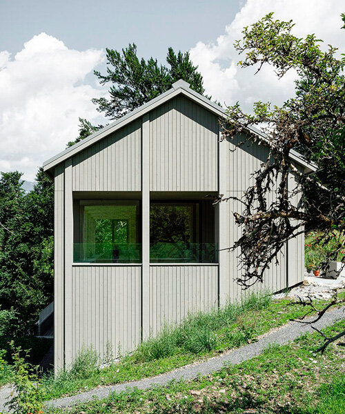 grey wooden framework shapes stable-like residence in swiss village