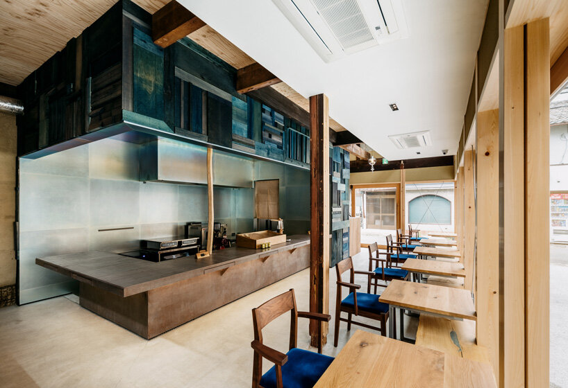 craftsman's handiwork plays with industrial touches within cozy café in kyoto city