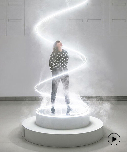 giant spiralling installation by karolina halatek immerses spectators in light + fog