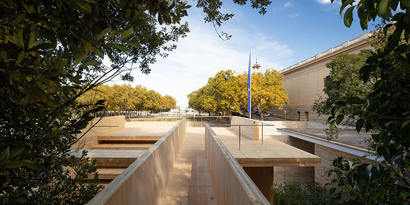 intricate timber installation 'mass is more' reinterprets mies van der rohe's barcelona pavilion