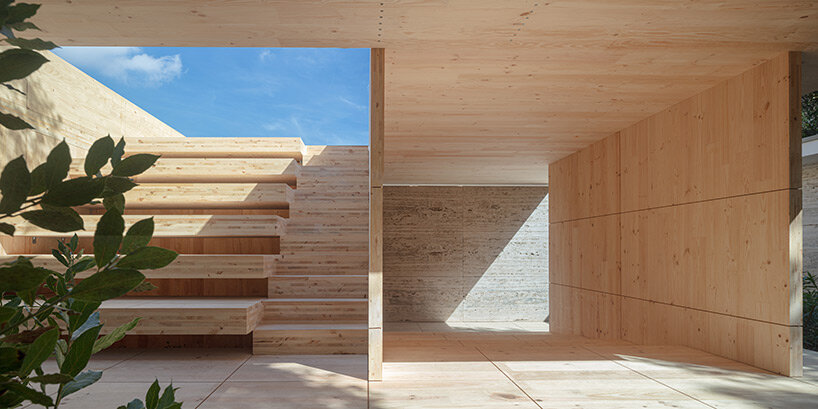 intricate timber installation 'mass is more' reinterprets mies van der rohe's barcelona pavilion