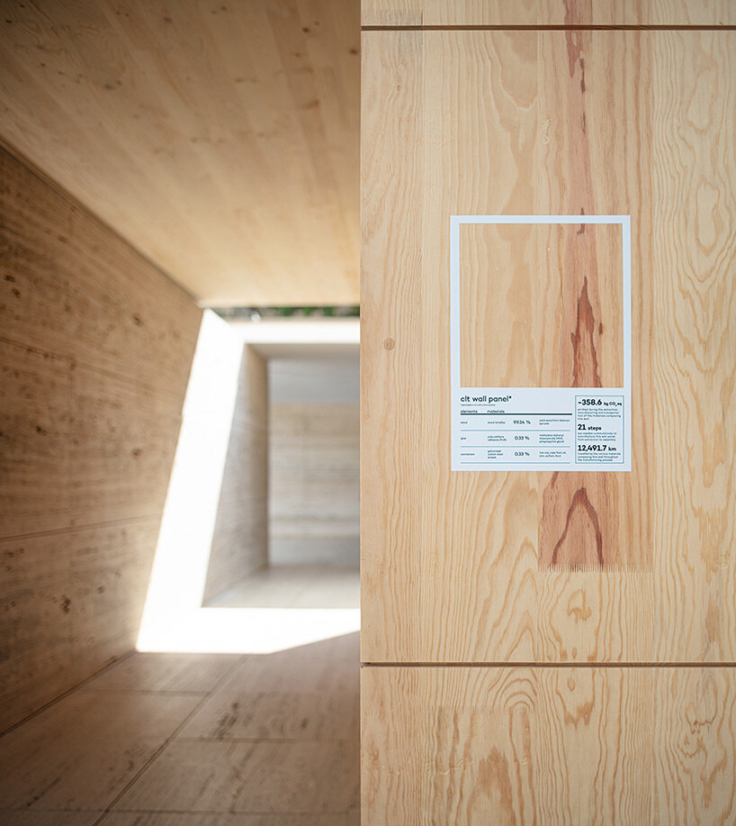 intricate timber installation 'mass is more' reinterprets mies van der rohe's barcelona pavilion