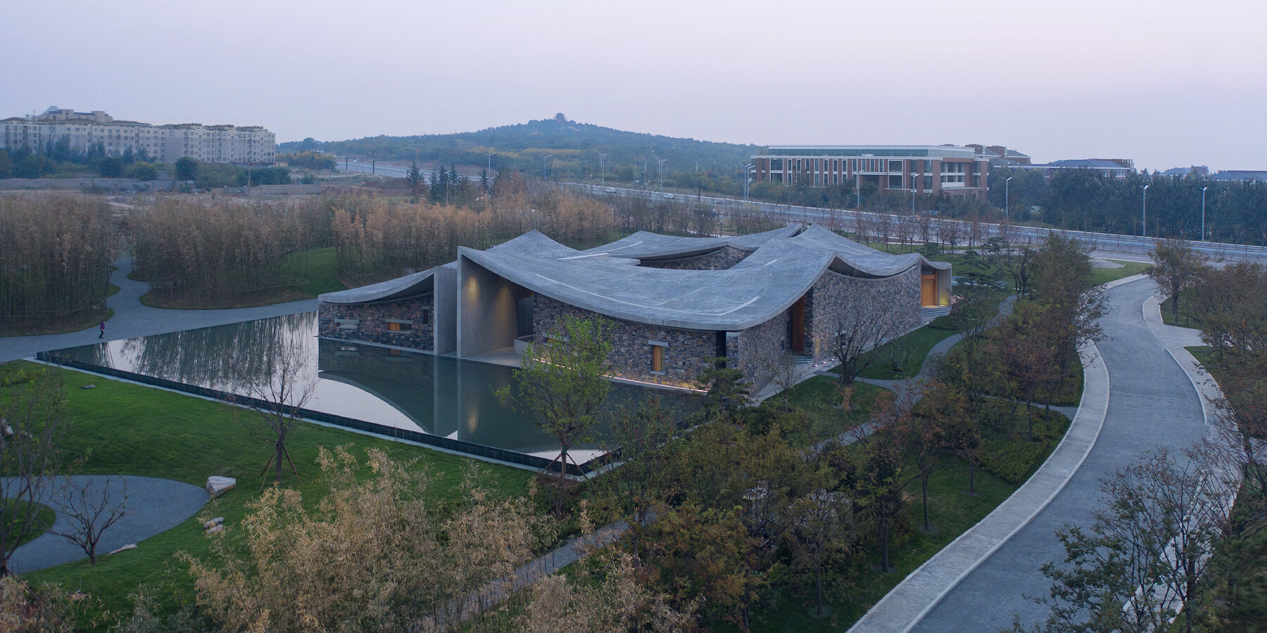 Studio Zhu Pei Tops Oct Art Center With Dramatic Concrete Curves