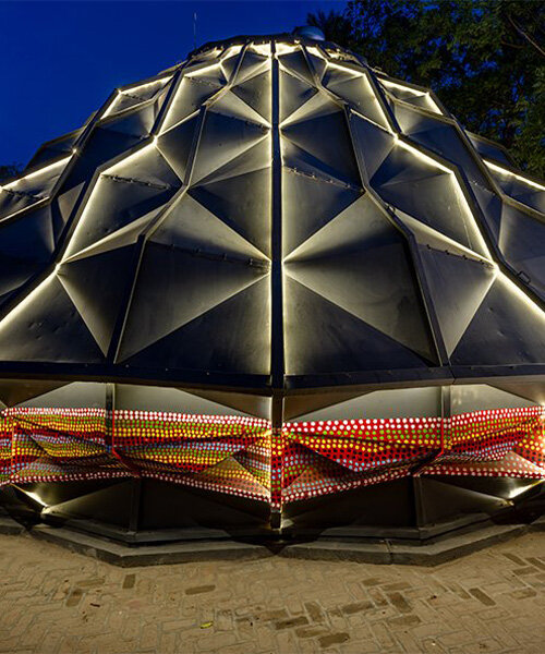 parametric metal tent with ridge paneled facade serves as multipurpose events space in india